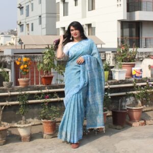 Light blue Tie-Dye cotton saree with white patterns and pom-pom border - Abhrikaa by Eka.