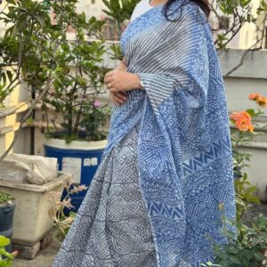 Model wearing an Abhrikaa Sky Blue Kota Saree with white geometric hand-block prints.