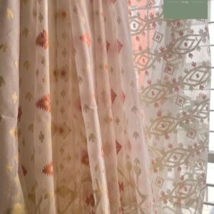 Detail of a Tangail Half Silk Jamdani Saree by Abhrikaa with hand-woven gold motifs on a white base.
