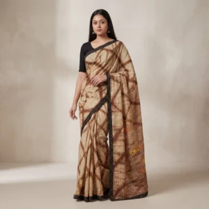 Woman wearing brown tie dye saree with black border, front full view